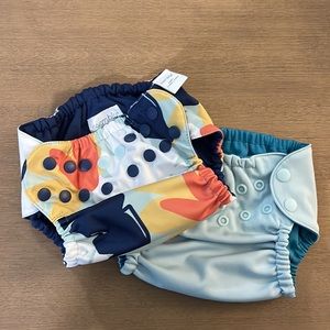 Two Esembly Diaper Outters size 1 Lagoon and and Monstera